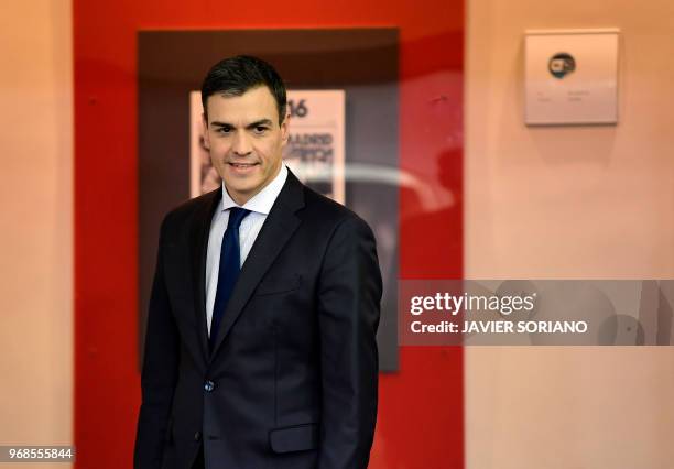 Spanish prime minister Pedro Sanchez arrives for a press conference to announce his new cabinet members at La Moncloa palace in Madrid on June 6,...