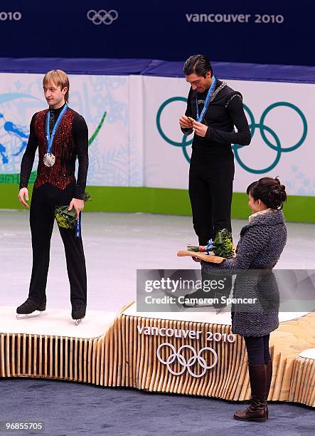 Gold medalist Evan Lysacek of the United States poses with silver medalist Evgeni Plushenko of Russia in the men's figure skating free skating on day...