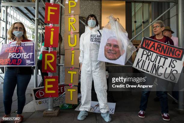 Protestors rally against Environmental Protection Agency Administrator Scott Pruitt outside the federal office building that houses the New York City...
