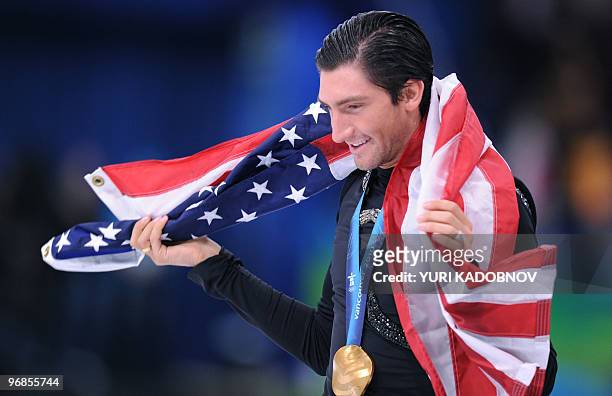 Gold medallist, US Evan Lysacek, does his honour lap after performing in the Men's Figure skating free program at the Pacific Coliseum in Vancouver...