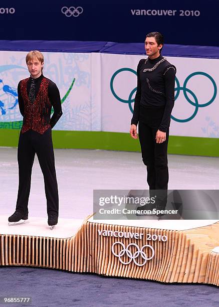 Gold medalist Evan Lysacek of the United States poses with silver medalist Evgeni Plushenko of Russia in the men's figure skating free skating on day...