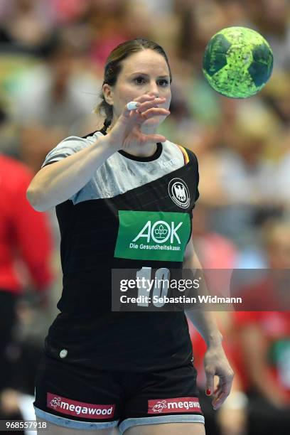 Anna Loerper of Germany catches the ball during the Women's handball International friendly match between Germany and Poland at Olympiahalle on June...