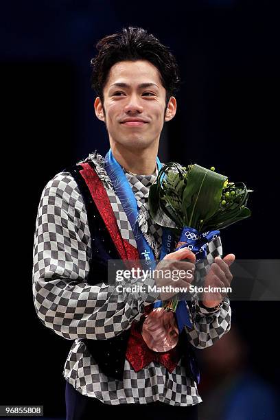 Bronze medalist Daisuke Takahashi of Japan holds his medal in the men's figure skating free skating on day 7 of the Vancouver 2010 Winter Olympics at...