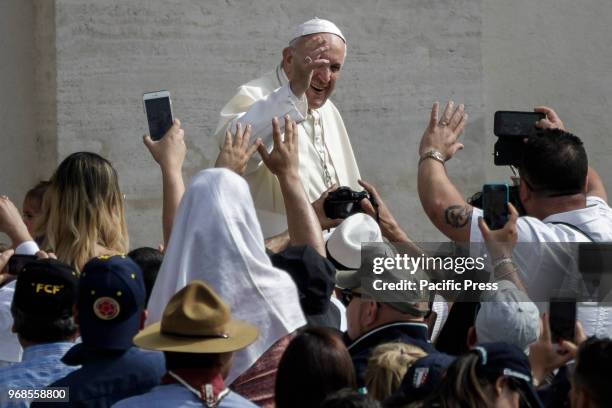 Pope Francis greets the audience during the Weekly General Audience in St. Peter's Square.