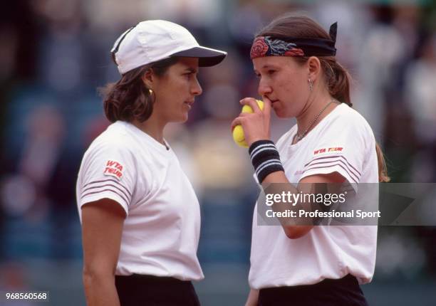 Natasha Zvereva of Belarus and Gigi Fernandez of the USA talking during a Women's Doubles match in the French Open Tennis Championships at the Stade...