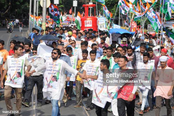 All India Trinamool Youth Congress supporters with huge cut-out of LPG cylinder in a protest rally against hike in the price of Petrol, Diesel, LPG...