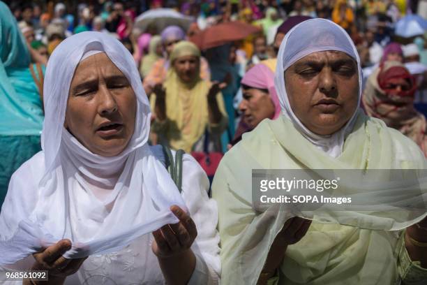 Kashmiri Muslim women devotee prays, at Hazratbal shrine to mark the death anniversary of Imam-e- Ali, the cousin and the son-in-law of the Prophet...