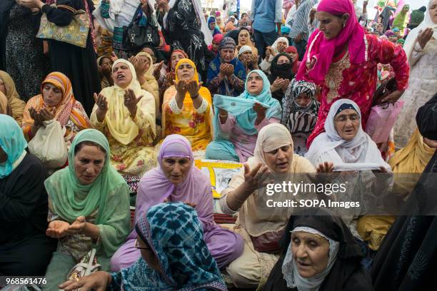 Kashmiri Muslim women devotee prays, at Hazratbal shrine to mark the death anniversary of Imam-e- Ali, the cousin and the son-in-law of the Prophet...