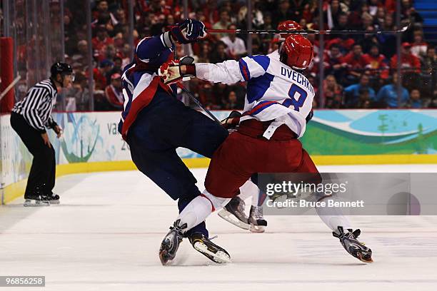 Alexander Ovechkin of Russia fights with Zdenko Chara of Slovakia during the ice hockey men's preliminary game between Slovakia and Russia on day 7...