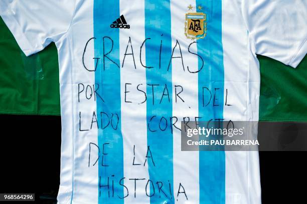 Picture shows a jersey of Argentina's national football team with a text reading "Thanks for being on the right side of history" as pro-Palestine...