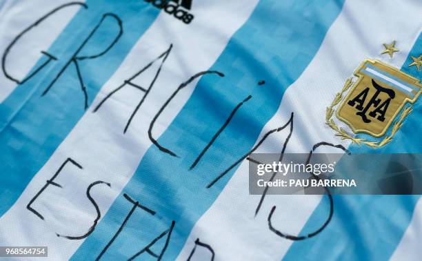 The word "Thanks" is written on a jersey of Argentina's national football team during a pro-Palestine gathering to celebrate the cancellation of a...