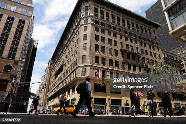 People walk by Lord & Taylor's flagship store on 5th Avenue in Manhattan on June 6, 2018 in New York City. The 192-year-old chain owned by Canada's...
