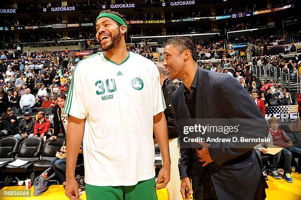 Rasheed Wallace of the Boston Celtics and former NBA player Rick Fox share a laugh during halftime of a game between the Boston Celtics and the Los...