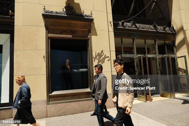 People walk by Lord & Taylor's flagship store on 5th Avenue in Manhattan on June 6, 2018 in New York City. The 192-year-old chain owned by Canada's...