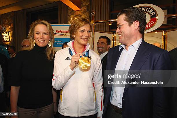 Gold medalist Maria Riesch of Germany poses with German Defense Minister Karl-Theodor zu Guttenberg and his wife Stephanie zu Guttenberg and her gold...