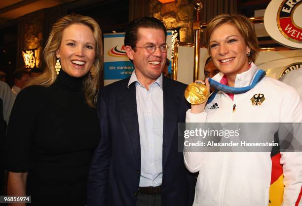 Gold medalist Maria Riesch of Germany poses with German Defense Minister Karl-Theodor zu Guttenberg and his wife Stephanie zu Guttenberg and her gold...