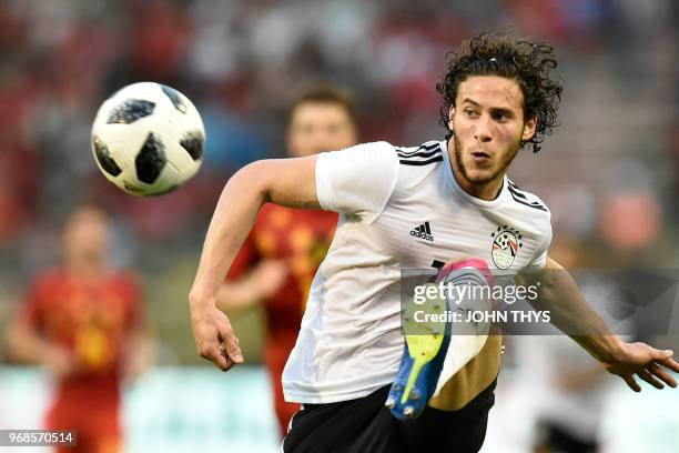 Egypt's midfielder Ramadan Sobhi eyes the ball as he controls it during the international friendly football match between Belgium and Egypt at the...