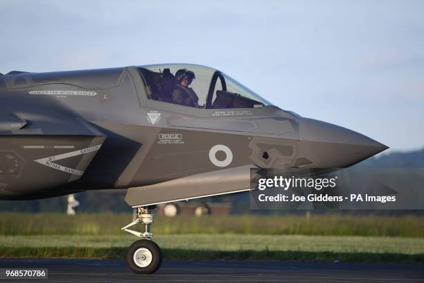 Wing Commander John Butcher in the cockpit after piloting the first Britain's F-35B jets to RAF Marham in Norfolk.