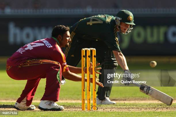 Ravi Rampaul of West Indies attempts to run out Adam Voges of Australia during the Fifth One Day International match between Australia and the West...