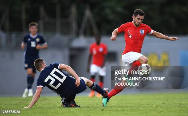 Scotland's midfielder Alan Campbell vies with England's midfielder Lewis Cook during the Festival International Espoirs - Maurice Revello Tournament...