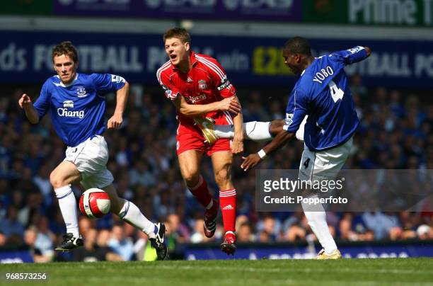 Joseph Yobo of Everton tackles Steven Gerrard of Liverpool during the Barclays Premiership match between Everton and Liverpool at Goodison Park in...