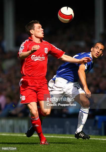Steve Finnan of Liverpool moves past Leon Osman of Everton during the Barclays Premiership match between Everton and Liverpool at Goodison Park in...