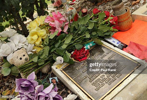 Tributes adorn the memorial of Bon Scott on the 30th anniversary of AC/DC's former frontman's death, at Fremantle cemetery on February 19, 2010 in...