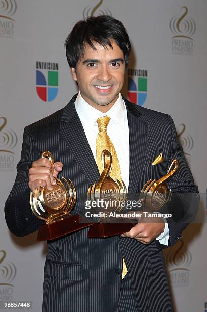 Luis Fonsi poses in the press room at Univision's 2010 Premio Lo Nuestro a La Musica Latina Awards at American Airlines Arena on February 18, 2010 in...