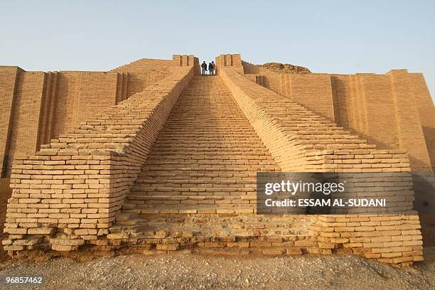 People visit the stepped Ziggurat temple, a three-tiered edifice dating back to 2113 BC, in the ancient city of Ur in southern Iraq on February 4,...