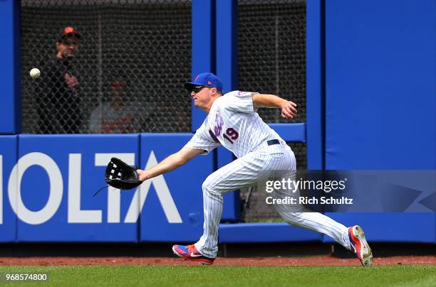 Right fielder Jay Bruce of the New York Mets makes a catch on a ball hit by Chris Davis of the Baltimore Orioles out during the seventh inning of a...
