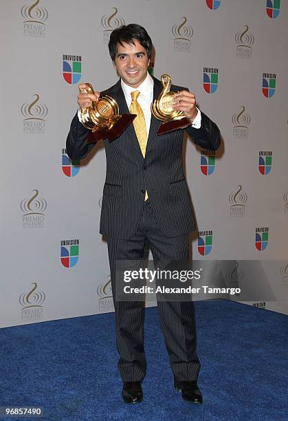 Luis Fonsi poses in the press room at Univision's 2010 Premio Lo Nuestro a La Musica Latina Awards at American Airlines Arena on February 18, 2010 in...