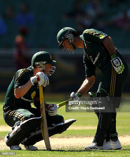 Ricky Ponting walks down the pitch to check on the health of Michael Clarke of Australia after he was hit in the groin during the Fifth One Day...