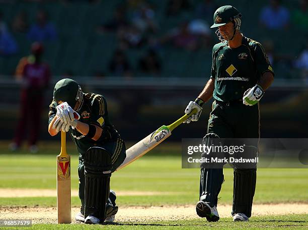 Ricky Ponting walks down the pitch to check on the health of Michael Clarke of Australia after he was hit in the groin during the Fifth One Day...