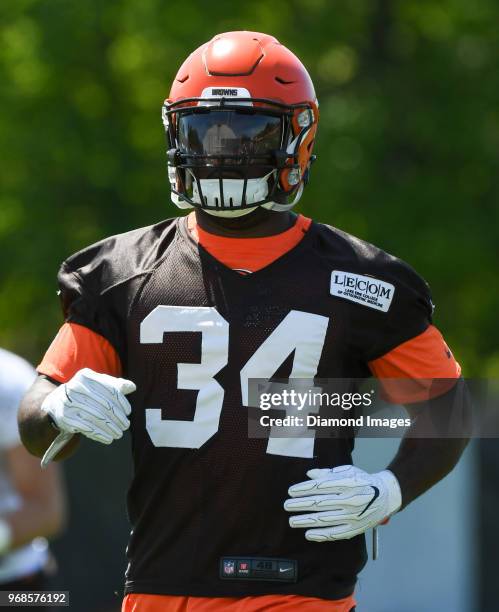 Running back Carlos Hyde of the Cleveland Browns stretches during an OTA practice at the Cleveland Browns training facility in Berea, Ohio.