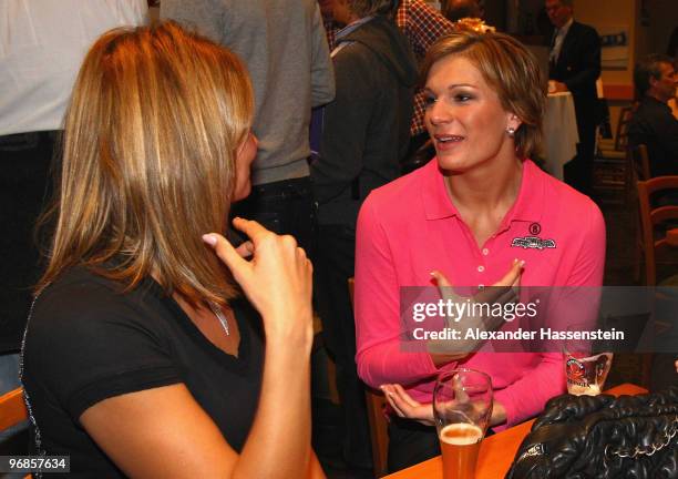 Gold medalist Maria Riesch of Germany talks to Olympic gold medalist swimmer Franziska van Almsick about her gold medal for the women's Super...