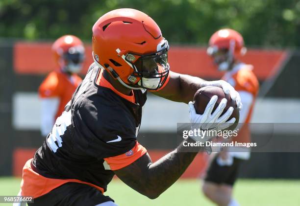 Running back Carlos Hyde of the Cleveland Browns catches a pass during an OTA practice at the Cleveland Browns training facility in Berea, Ohio.