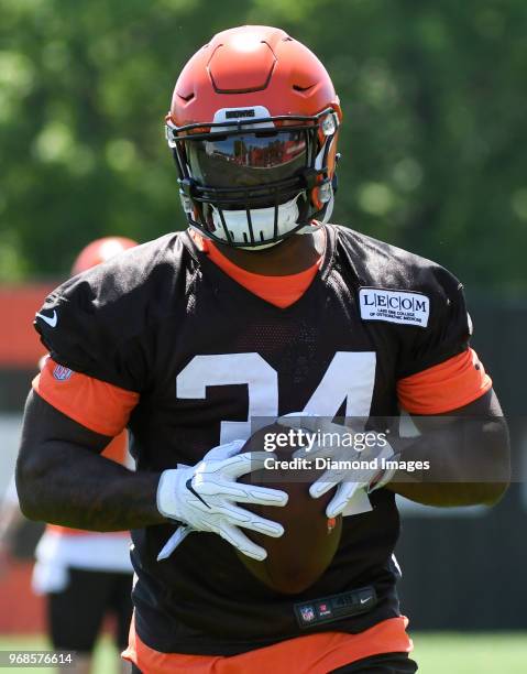 Running back Carlos Hyde of the Cleveland Browns carries the ball during an OTA practice at the Cleveland Browns training facility in Berea, Ohio.