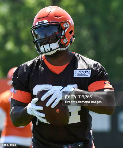 Running back Carlos Hyde of the Cleveland Browns carries the ball during an OTA practice at the Cleveland Browns training facility in Berea, Ohio.