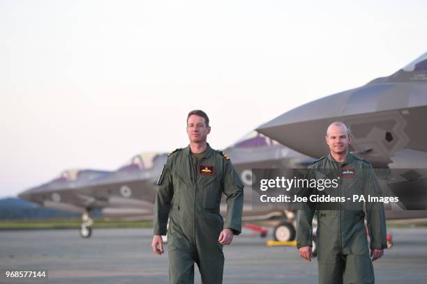 Wing Commander John Butcher and Wing Lieutenant Adam Hogg after piloting the first Britain's F-35B jets to RAF Marham in Norfolk.