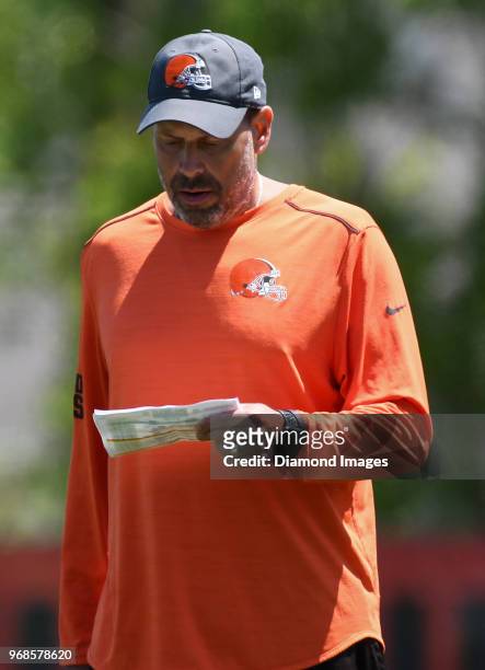 Offensive coordinator Todd Haley of the Cleveland Browns reads from his play sheet during an OTA practice at the Cleveland Browns training facility...
