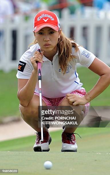 Momoko Ueda of Japan lines up a putt on the second day of the Honda-PTT LPGA Thailand 2010 golf tournament in the Thai resort of Pattaya on February...