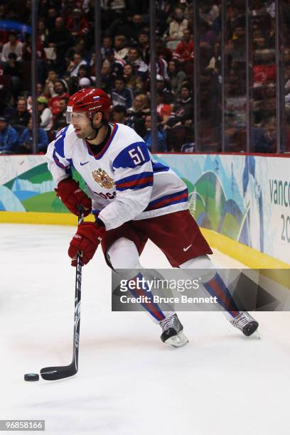 Fedor Tyutin of Russia skates with the puck during the ice hockey men's preliminary game between Slovakia and Russia on day 7 of the 2010 Winter...