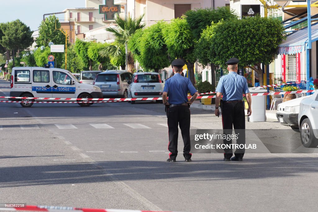 Carabinieri at the scene of the murder of Leonardo Portoraro...