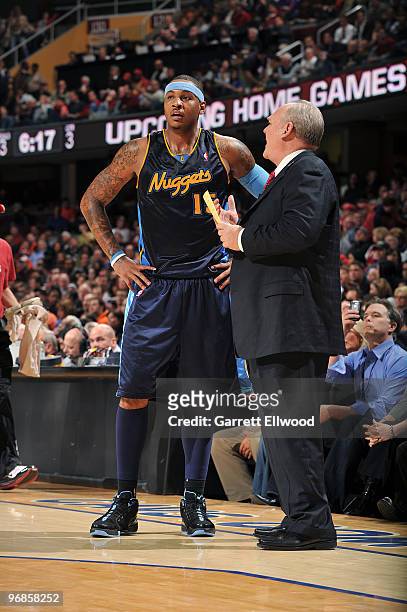 Carmelo Anthony and head coach George Karl of the Denver Nuggets talk during the game against the Cleveland Cavaliers on February 18, 2010 at Quicken...