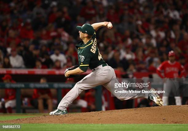 Pitcher Daniel Gossett of the Oakland Athletics pitches in the second inning during the MLB game against the Los Angeles Angels of Anhaeim at Angel...