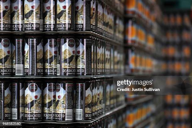 Stacks of empty aluminum cans sit in a warehouse at Devil's Canyon Brewery on June 6, 2018 in San Carlos, California. New tariffs imposed by U.S....