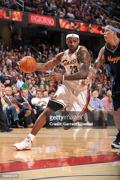 LeBron James of the Cleveland Cavaliers drives to the basket against Chris Andersen of the Denver Nuggets on February 18, 2010 at Quicken Loans Arena...