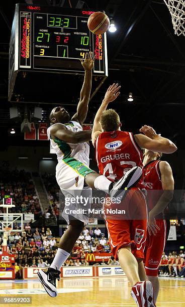 Rolan Roberts of Townsville drives to the basket during game one of the NBL semi final series between the Wollongong Hawks and the Townsville...
