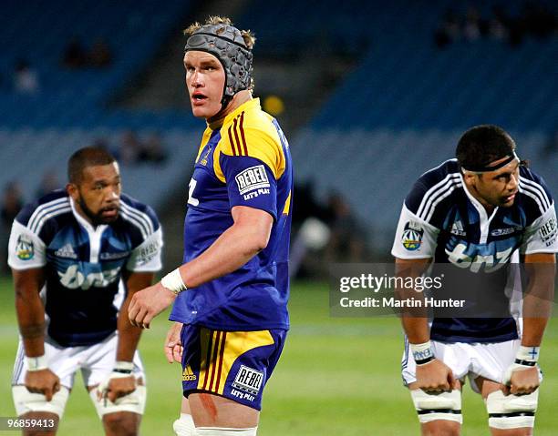 Josh Bekhuis of the Highlanders leaves the field after being sin binned during the round two Super 14 match between the Highlanders and the Blues at...