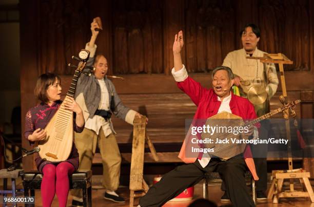 Chinese pipa player and cultural ambassador Wu Man performs with leader, lead vocalist, and yueqin player Zhang Ximin and members of the Huayin...